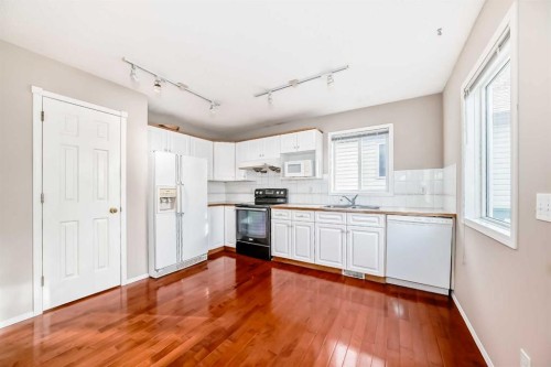 83 Harvest Gold Circle Ne, Calgary, AB - Indoor Photo Showing Kitchen With Double Sink