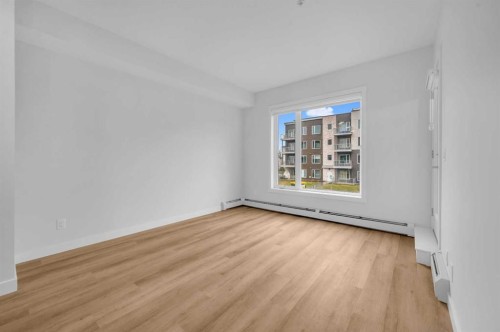 212-660 Shawnee Square Sw, Calgary, AB - Indoor Photo Showing Other Room