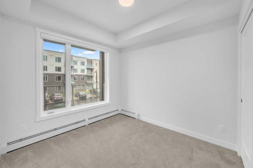 212-660 Shawnee Square Sw, Calgary, AB - Indoor Photo Showing Other Room