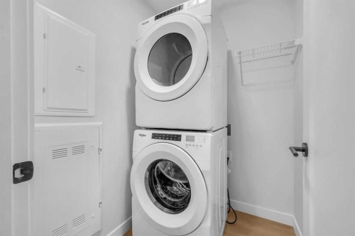 212-660 Shawnee Square Sw, Calgary, AB - Indoor Photo Showing Laundry Room