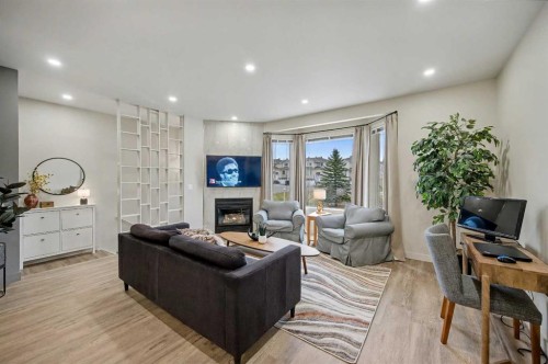 124 Country Hills Gardens Nw, Calgary, AB - Indoor Photo Showing Other Room With Fireplace