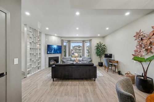 124 Country Hills Gardens Nw, Calgary, AB - Indoor Photo Showing Living Room With Fireplace