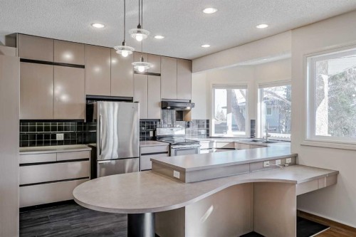 127 Canterbury Court Sw, Calgary, AB - Indoor Photo Showing Kitchen With Stainless Steel Kitchen With Upgraded Kitchen