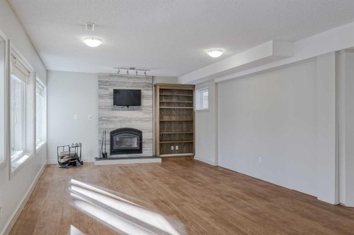127 Canterbury Court Sw, Calgary, AB - Indoor With Fireplace