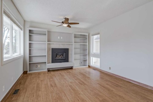 127 Canterbury Court Sw, Calgary, AB - Indoor Photo Showing Other Room With Fireplace