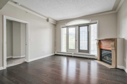 206-1315 12 Avenue Sw, Calgary, AB - Indoor With Fireplace