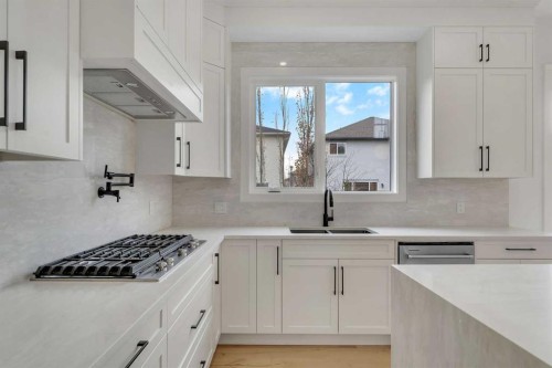 236 East Lakeview Place, Chestermere, AB - Indoor Photo Showing Kitchen With Double Sink With Upgraded Kitchen