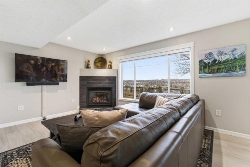 167 Hidden Creek Gardens Nw, Calgary, AB - Indoor Photo Showing Living Room With Fireplace