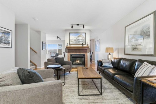 167 Hidden Creek Gardens Nw, Calgary, AB - Indoor Photo Showing Living Room With Fireplace