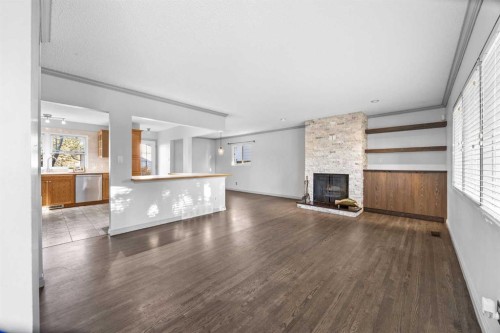 10444 Maplecreek Drive Se, Calgary, AB - Indoor Photo Showing Living Room With Fireplace