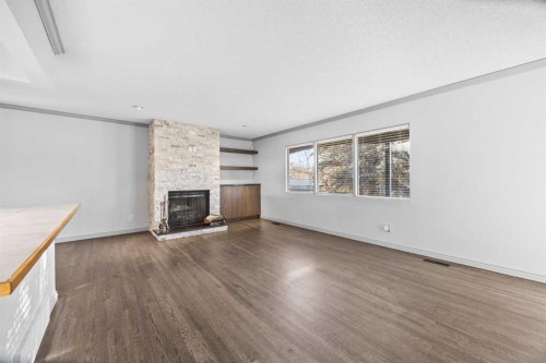 10444 Maplecreek Drive Se, Calgary, AB - Indoor Photo Showing Living Room With Fireplace