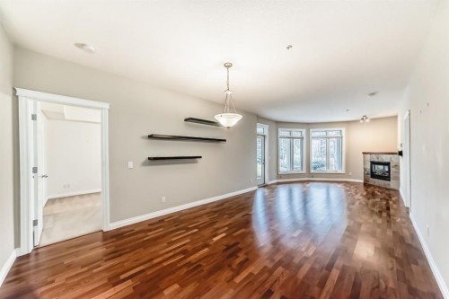 106-6 Hemlock Crescent Sw, Calgary, AB - Indoor With Fireplace