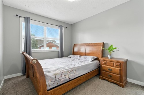313 Kings Heights Drive Se, Airdrie, AB - Indoor Photo Showing Bedroom