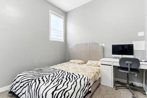 313 Kings Heights Drive Se, Airdrie, AB - Indoor Photo Showing Bedroom