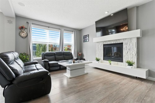 313 Kings Heights Drive Se, Airdrie, AB - Indoor Photo Showing Living Room With Fireplace