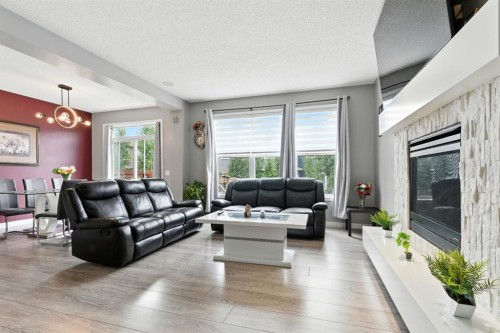 313 Kings Heights Drive Se, Airdrie, AB - Indoor Photo Showing Living Room With Fireplace