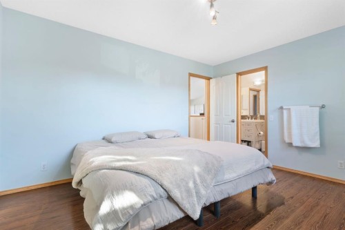 179 Quigley Drive, Cochrane, AB - Indoor Photo Showing Bedroom