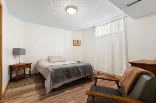 179 Quigley Drive, Cochrane, AB - Indoor Photo Showing Bedroom