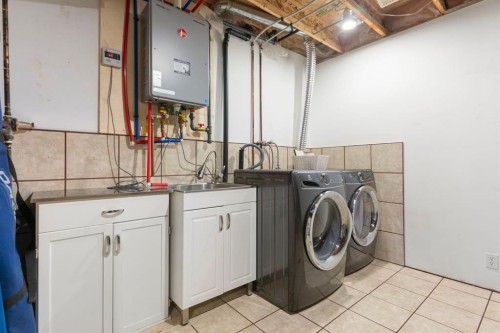 179 Quigley Drive, Cochrane, AB - Indoor Photo Showing Laundry Room