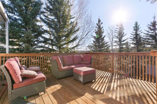 179 Quigley Drive, Cochrane, AB - Outdoor With Deck Patio Veranda