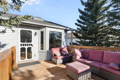 179 Quigley Drive, Cochrane, AB - Outdoor With Deck Patio Veranda With Exterior