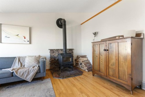 179 Quigley Drive, Cochrane, AB - Indoor With Fireplace