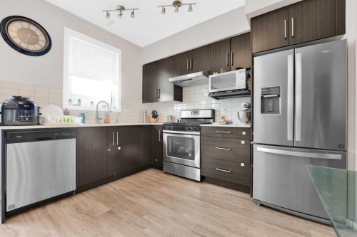 202-135 Redstone Walk Ne, Calgary, AB - Indoor Photo Showing Kitchen With Stainless Steel Kitchen
