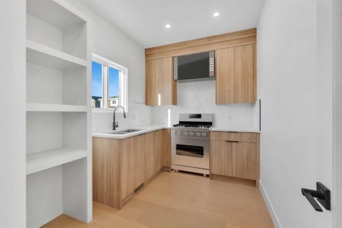 99 South Shore Road, Chestermere, AB - Indoor Photo Showing Kitchen With Double Sink