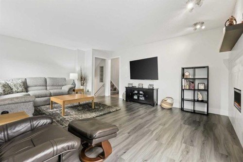 103 Sandarac Place Nw, Calgary, AB - Indoor Photo Showing Living Room With Fireplace