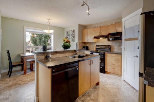 469 Morningside Way Sw, Airdrie, AB - Indoor Photo Showing Kitchen With Double Sink