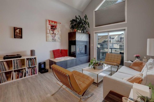 403-1441 23 Avenue Sw, Calgary, AB - Indoor Photo Showing Living Room With Fireplace