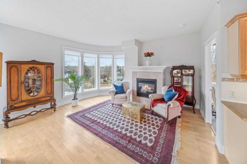 401-4 14 Street Nw, Calgary, AB - Indoor Photo Showing Living Room With Fireplace