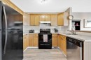 166 Harvest Rose Circle Ne, Calgary, AB  - Indoor Photo Showing Kitchen With Double Sink 