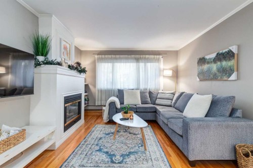105-230 21 Avenue Sw, Calgary, AB - Indoor Photo Showing Living Room With Fireplace