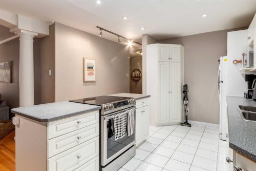105-230 21 Avenue Sw, Calgary, AB - Indoor Photo Showing Kitchen With Double Sink
