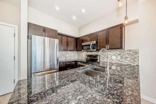 201-4303 1 Street Ne, Calgary, AB - Indoor Photo Showing Kitchen With Stainless Steel Kitchen With Double Sink With Upgraded Kitchen