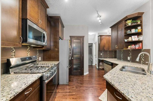 187 Sage Hill Green Nw, Calgary, AB - Indoor Photo Showing Kitchen With Stainless Steel Kitchen With Double Sink With Upgraded Kitchen