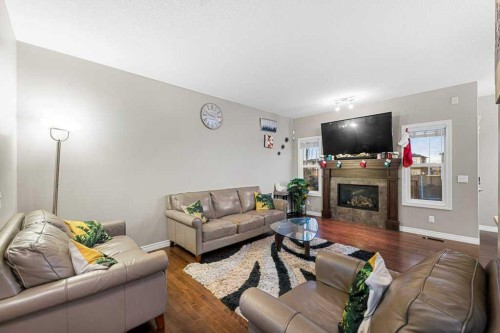 187 Sage Hill Green Nw, Calgary, AB - Indoor Photo Showing Living Room With Fireplace