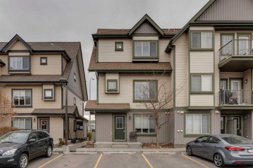 1404-121 Copperpond Common Se, Calgary, AB - Outdoor With Balcony With Facade