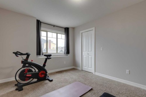 1404-121 Copperpond Common Se, Calgary, AB - Indoor Photo Showing Gym Room