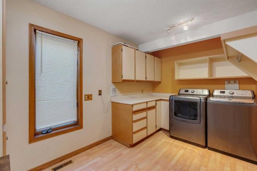 223 Shawnee Mews Sw, Calgary, AB - Indoor Photo Showing Laundry Room