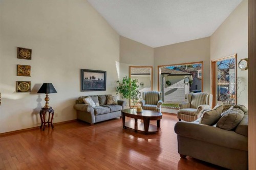 223 Shawnee Mews Sw, Calgary, AB - Indoor Photo Showing Living Room With Fireplace