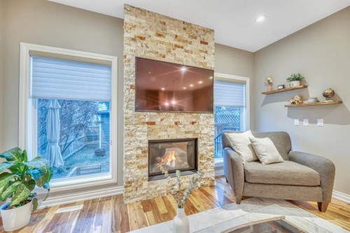 1813 20 Avenue Nw, Calgary, AB - Indoor Photo Showing Living Room With Fireplace