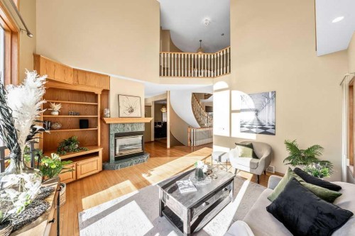 109 Lakeside Greens, Chestermere, AB - Indoor Photo Showing Living Room With Fireplace