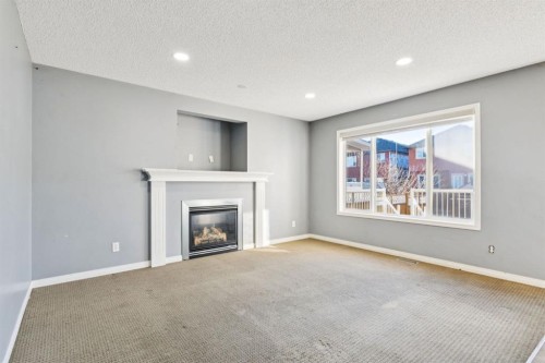 8454 Saddleridge Drive Ne, Calgary, AB - Indoor Photo Showing Living Room With Fireplace