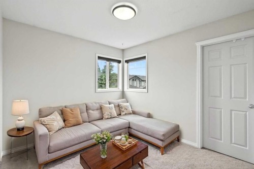 21-102 Canoe Square Sw, Airdrie, AB - Indoor Photo Showing Living Room