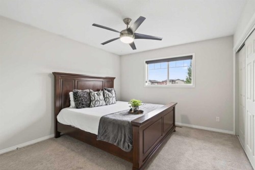 21-102 Canoe Square Sw, Airdrie, AB - Indoor Photo Showing Bedroom