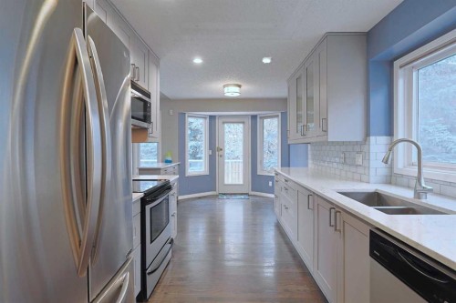 220 Silver Creek Mews Nw, Calgary, AB - Indoor Photo Showing Kitchen With Stainless Steel Kitchen With Double Sink With Upgraded Kitchen