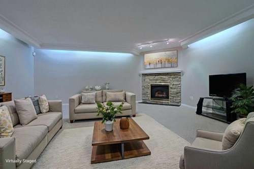 220 Silver Creek Mews Nw, Calgary, AB - Indoor Photo Showing Living Room With Fireplace