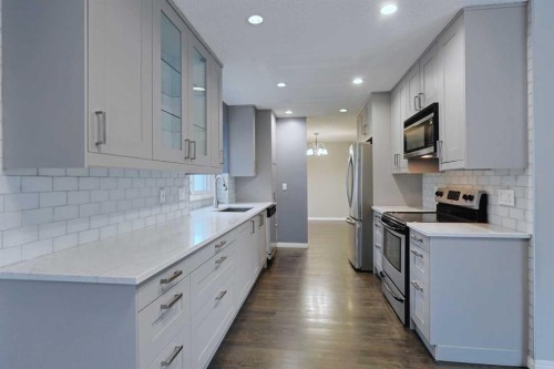 220 Silver Creek Mews Nw, Calgary, AB - Indoor Photo Showing Kitchen With Stainless Steel Kitchen With Upgraded Kitchen